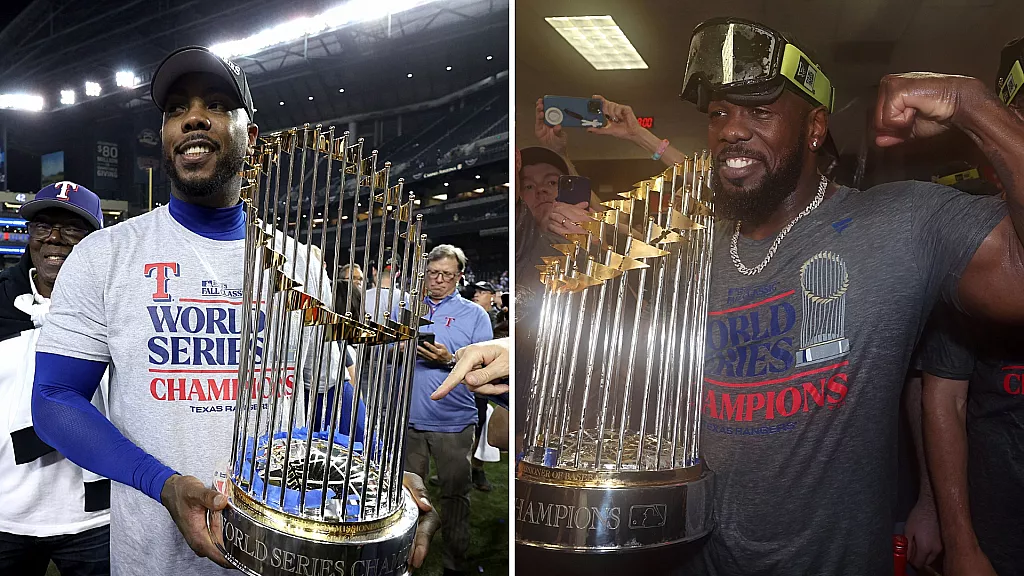 Dos cubanos con el trofeo de campeones de la Serie Mundial 2023